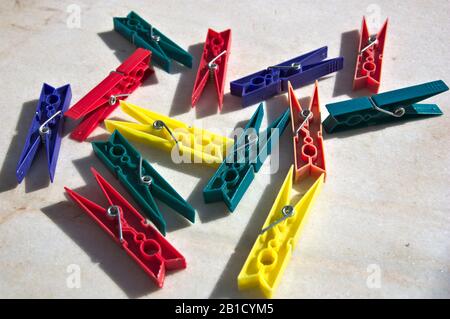 Close-up of a pair of clothes pegs on a worn gray marble Stock Photo