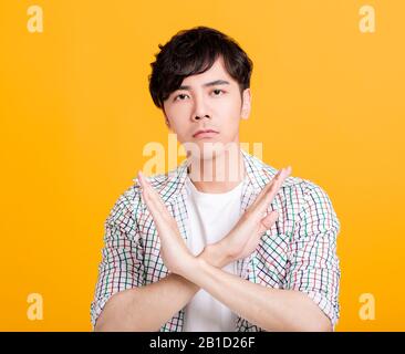 young man Refuse gesture, crossed hands Stock Photo