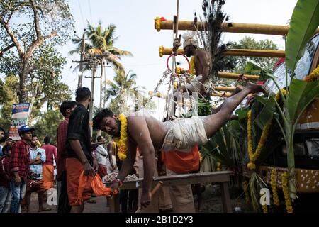 devotee-hanging-by-hook-piercings-as-a-ritualistic-act-of-devotion