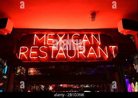 Miami Beach, Florida - February 20, 2020 - Red neon Mexican Restaurant sign on Lincoln Road Mall at night. Stock Photo