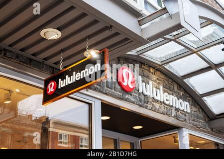 BANFF, CANADA - FEB 15, 2020 : Lululemon store with its sign on busy Banff Avenue in Alberta, Canada. The athletic apparel retailer is made famous for Stock Photo