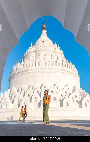 Beautiful young Burmese woman at Hsinbyume Pagoda, Mingun, Mandalay Region, Myanmar Stock Photo