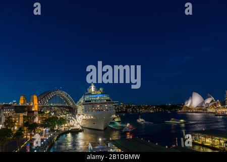 Sydney Harbour - April 20, 2017 - View of Circular Quay with moored ocean liner Celebrity Solstice and Sydney Harbour Bridge. Stock Photo