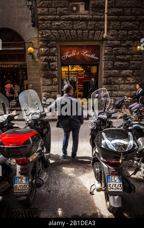 Italian man just hanging out watching the people go by, Florence, Italy. Stock Photo