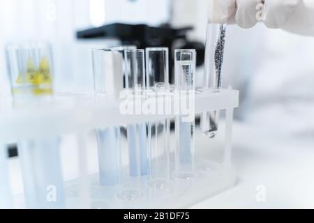 Professional scientist working in modern pharmacy lab Stock Photo