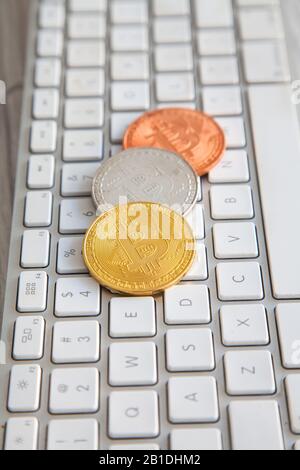Bitcoin king of crypto currency on a computer background, Gold, Bronze and Silver Stock Photo