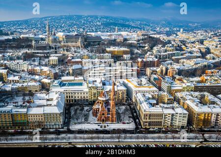 Budapest, Hungary - Aerial panoramic view of snowy Buda district with small reformed church, Matthias church and Fisherman's Bastion on a sunny winter Stock Photo