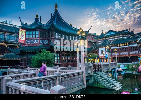 A few tourists brave the coronavirus in front of Huxinting teahouse in Shanghai’s Yuyuan. Stock Photo