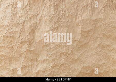Large piece of crumpled craft paper as a background or backdrop. Stock Photo