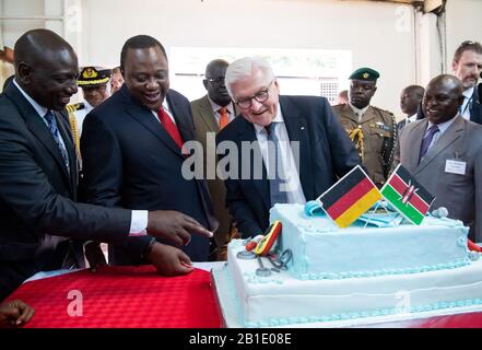 Nairobi, Kenya. 25th Feb, 2020. Federal President Frank-Walter Steinmeier (3rd from left) and Uhuru Kenyatta (2nd from left), President of Kenya, visit the Kiambu Institute of Science and Technology (KIST) and look at a cake decorated with Kenyan and German flags. Federal President Steinmeier is on a three-day state visit to Kenya. Credit: Bernd von Jutrczenka/dpa/Alamy Live News Stock Photo