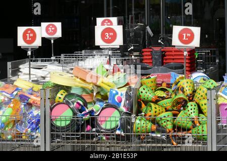 Colorful plastic toys with price tags in front of a shopping mall, Germany Stock Photo