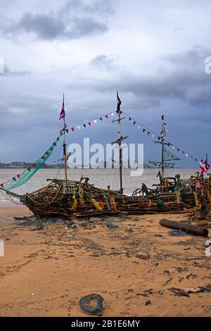 The Black Pearl Pirate Ship on the beach at New Brighton Wallasey after a heavy storm with the Liverpool waterfront buildings in the distance. Stock Photo