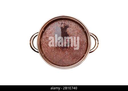 Beet soup in a pot with handles, a flat top view, isolated on a white background with a clipping path. Stock Photo