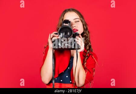 Professional camera. Girl with retro camera. Capture moments. SLR camera. Courses for photographers. Education for reporters and journalists. Learn use presets. Editing photos. Manual settings. Stock Photo