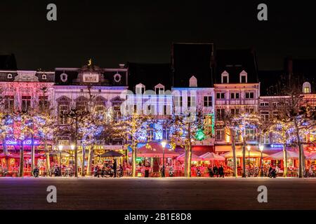 MAASTRICHT, THE NETHERLANDS - NOVEMBER 22, 2016: Bars and restaurants with christmas lights on the famous Vrijthof square in Maastricht, The Netherlan Stock Photo