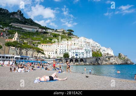 Panoramic view of small haven of Amalfi village with tiny beach and colorful houses, located on rock, Amalfi coast. Stock Photo