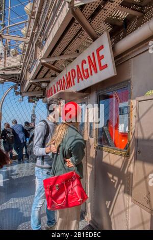 Paris, France - September 18, 2019: Visitors at the champagne shop located on top of the Eiffel tower. Stock Photo