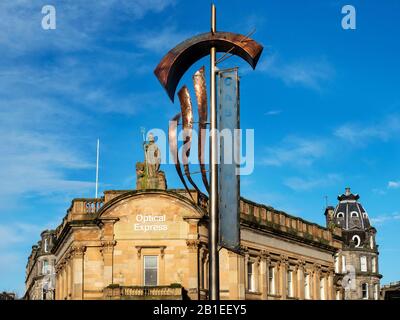 Former Clydesdale Bank Building topped by Britannia statue and Castle Hill banner on High Street Dundee Scotland Stock Photo