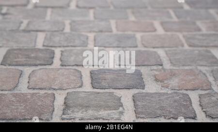 Background image of set of granite Grey brick stone street road. Light sidewalk, pavement Stock Photo