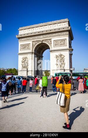 Paris/France - September 10, 2019 : Tourist taking pictures in front of Arc de Triomphe on place de l’Etoile Stock Photo