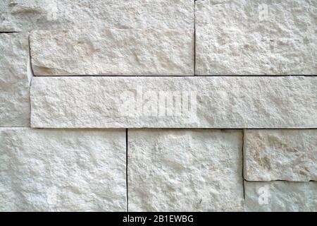 a white block detailed slate rock wall close-up shadowing Stock Photo