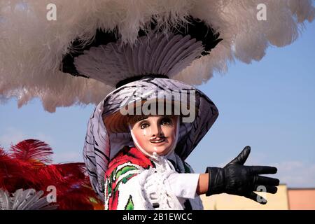 Portrait of a Charros dancer's mask and hat with dancing hand gesture from a Litter of Huehues in traditional Mexican costumes at Tlaxcala Carnival. Stock Photo