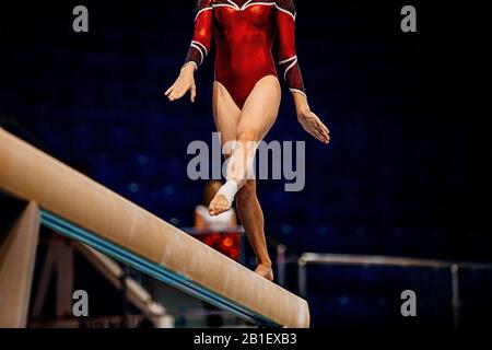women balance beam artistic gymnastics in summer games Stock Photo