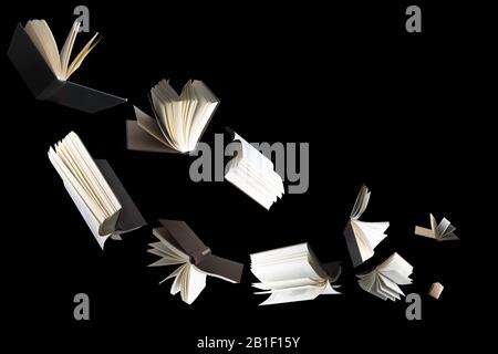 Flying several books isolated on black background. Stock Photo