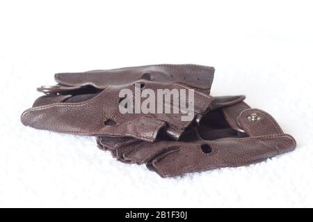 Brown fingerless leather driving gloves on white background Stock Photo