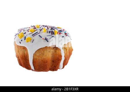 Easter cake freshly baked at home with icing and colored decorations isolated on a white background. Traditional Slavic, Russian,Ukrainian festive hom Stock Photo
