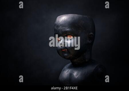 Creepy doll in the dark Stock Photo