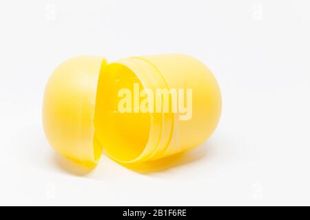a yellow open toy egg on white background Stock Photo