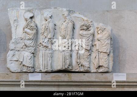 Five girls walking, East Frieze, Parthenon Marbles, also known as the Elgin Marbles at the British Museum, Parthenon Gallery, London, England UK Stock Photo