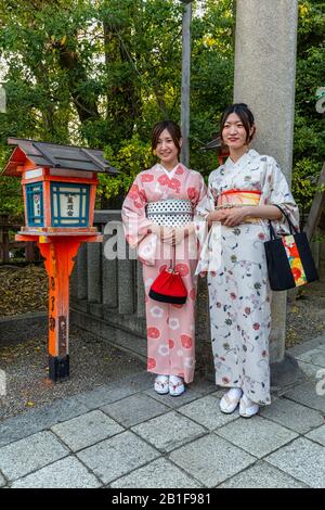 Kyoto Japan. Two women dressed in traditional kimono garment