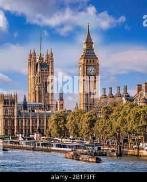 Big Ben and Houses of Parliament with boats on the river in London, England, UK Stock Photo