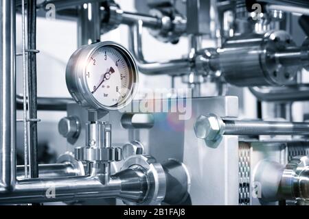 Stainless steel pipes in the factory. Construction on food production, Abstract industry background. Stock Photo