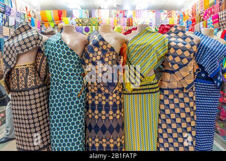 Six colorful African fabrics presented as dresses on mannequins in Maputo, Mozambique Stock Photo
