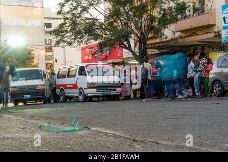 Maputo, Mozambique - May 15, 2019: Many local people entering a bus in the capital city Stock Photo