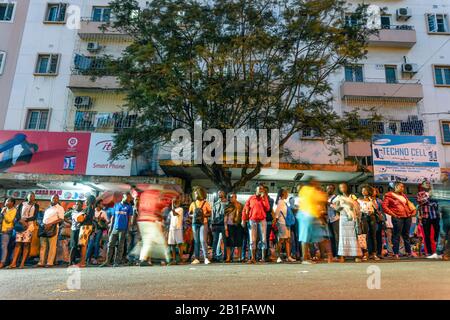 Maputo, Mozambique - May 15, 2019: Many local people waiting for a bus in the capital city Stock Photo