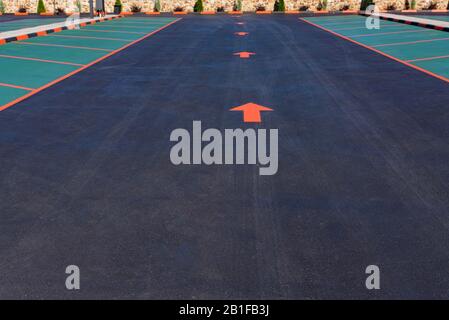 Close view parking lane with arrow showing direction Stock Photo