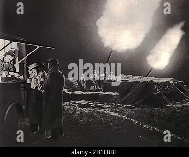 London,blitz,German bombing,Britain,second world war,mass air offensive,raid,Battle of Britain Hot cups of tea are served from a mobile canteen even as guns blaze nearby Stock Photo