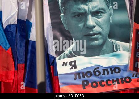Moscow, Russia. 26th of February, 2017 Opposition supporters hold portrait of Russian politician Boris Nemtsov during a march in memory of murdered Kremlin critic Boris Nemtsov in central Moscow, Russia. The 55-year-old former first deputy prime minister under Boris Yeltsin was shot in the back several times just before midnight on February 27, 2015 as he walked across a bridge a stone's throw from the Kremlin walls. The Russian inscription reads 'I love Russia' Stock Photo