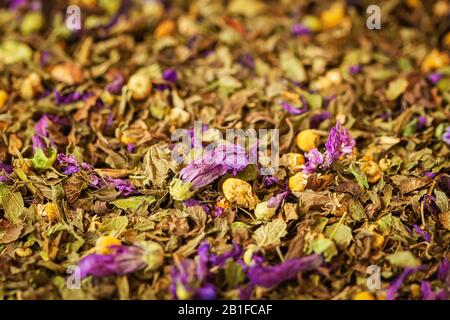Background of colorful dry blend petals herbal tea with flower petals, selective focus Stock Photo