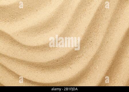 Wavy sea sand background. Flat lay. Top view Stock Photo