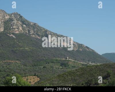 City walls of Ancient Messene from the Arcadian Gate up to the mountains behind Messini, Ithomi, Messenia, Peloponnese, Greece Stock Photo