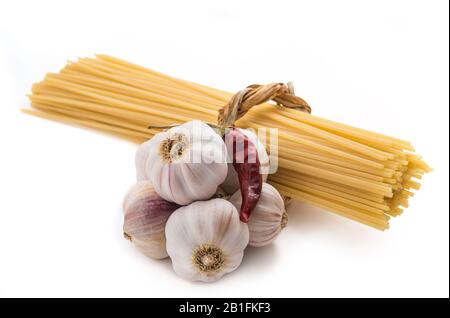 spaghetti with garlic and chili pepper isolated on white Stock Photo