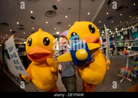 Jordan Willing, inventor of Blockaroos poses with “out of work” rubber duckies at the 117th North American International Toy Fair in the Jacob Javits Convention center in New York on Sunday, February 23, 2020. The ducks were protesting their replacement in baths by the Blockaroo toys..  The toy industry generates over $26 billion in the U.S. alone and Toy Fair is the largest toy trade show in the Western Hemisphere. (© Richard B. Levine) Stock Photo