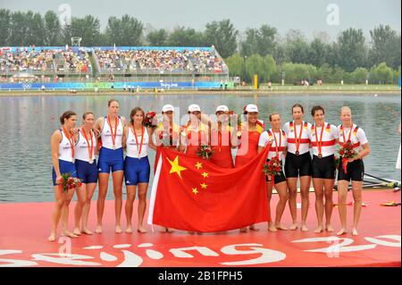 Shunyi, CHINA. Medal Presentation.  2008 Olympic Regatta, Shunyi Rowing Course.  Sun 17.08.2008.  [Mandatory Credit: Peter SPURRIER, Intersport Images.  centre; Gold medalist CHN W4X left to right  Bin Tang, Jin Ziwei, Aihua Xi, Yangyang Zhang)  Left; Silver medalist GBR W4X Annie VERNON, Debbie FLOOD, Frances HOUGHTON and Katerine GRAINGER  right;  Bronze  medalist  GER W4X left to right Britta Oppelt, Manuela Lutze, Kathrin Boron, Stephanie Schiller) Stock Photo