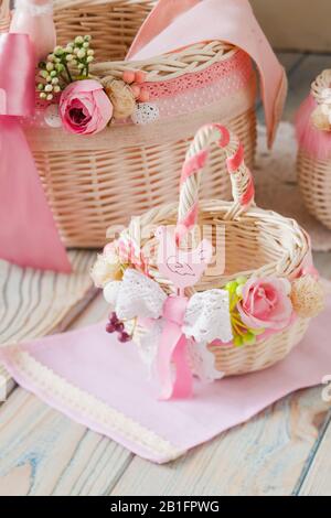 Two wicker baskets decorated in pink colours Stock Photo