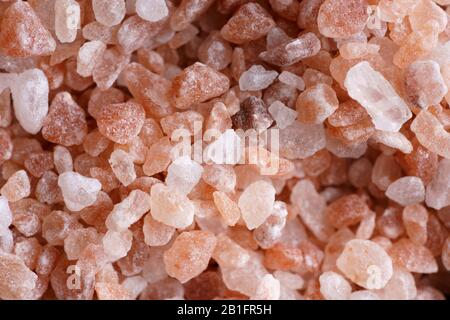 Macro shot of pink Himalayan salt. Black background, high resolution Stock Photo